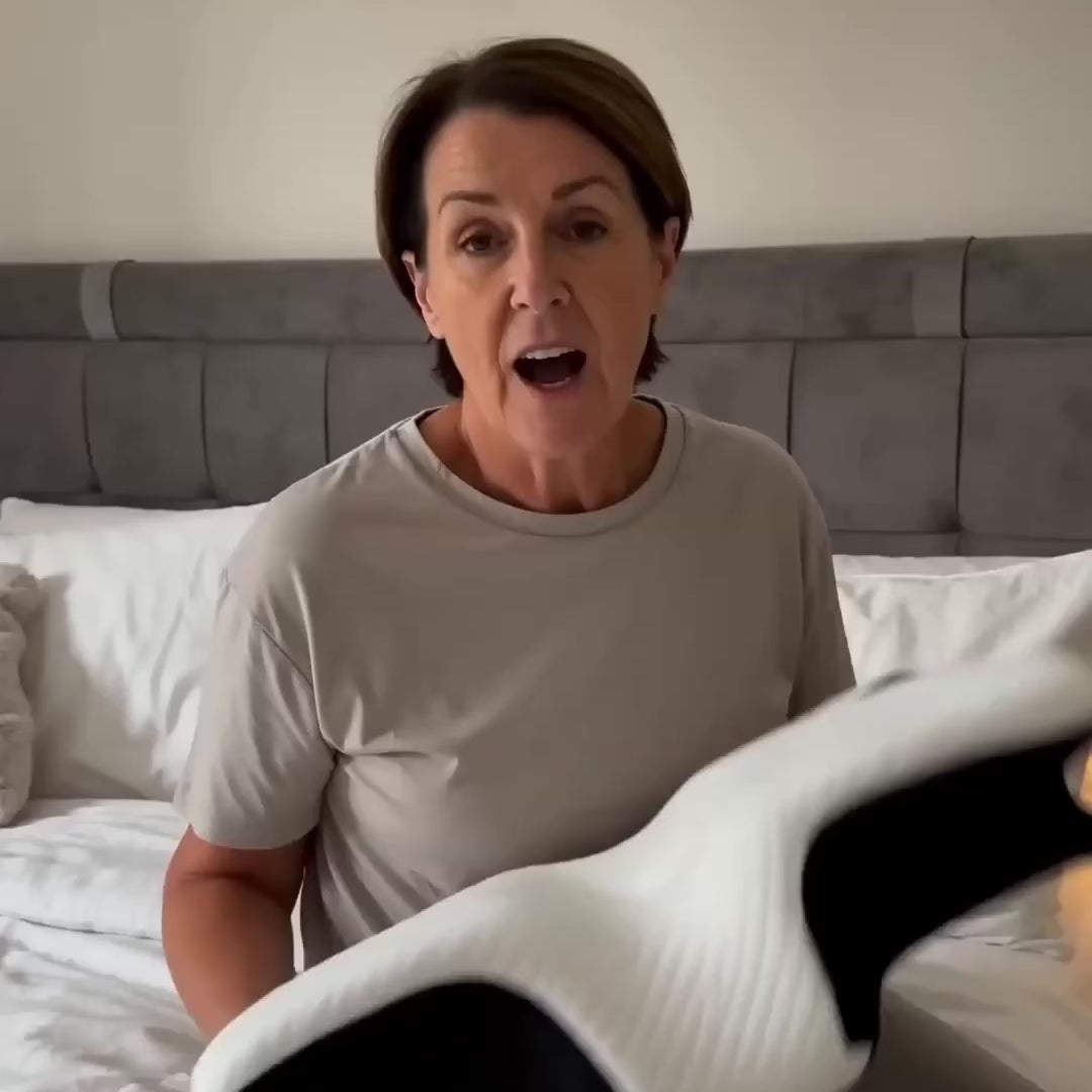 Woman talking about comfortable orthopaedic memory foam support pillow 